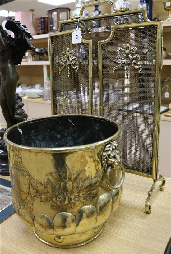 A brass log bin and a triptych fire screen